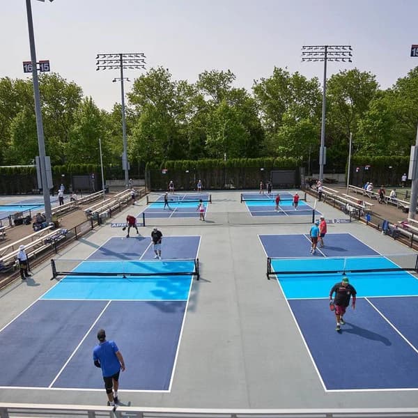 Outdoor pickleball courts in a community setting